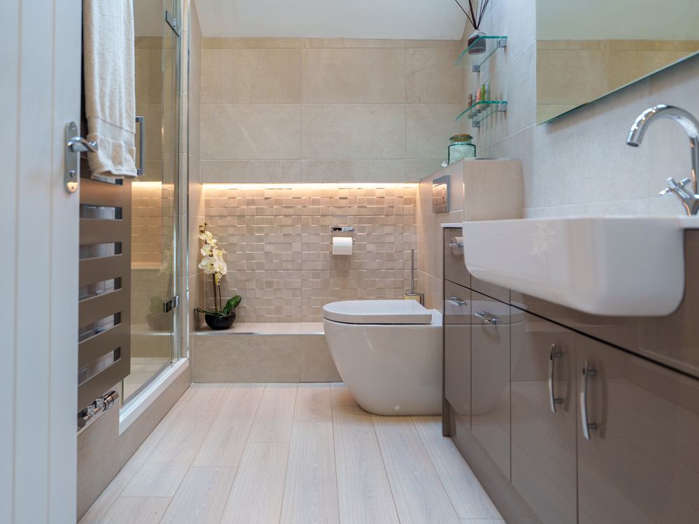 Bathroom with a walk-in shower, wall-hung basin and heated towel rail