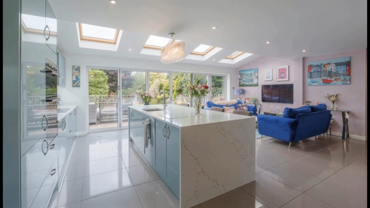 An architectural drawing of a room resolving into the finished open-plan kitchen